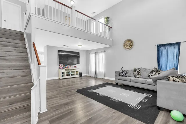 a living room with furniture and view of living room