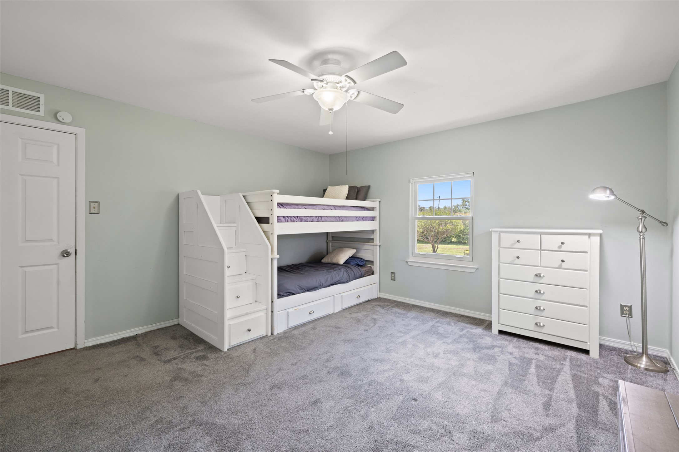17700 North Rim Drive Leander, TX 78641 - Photo 23 of 38 Bedroom featuring carpet flooring, baseboards, and ceiling fan