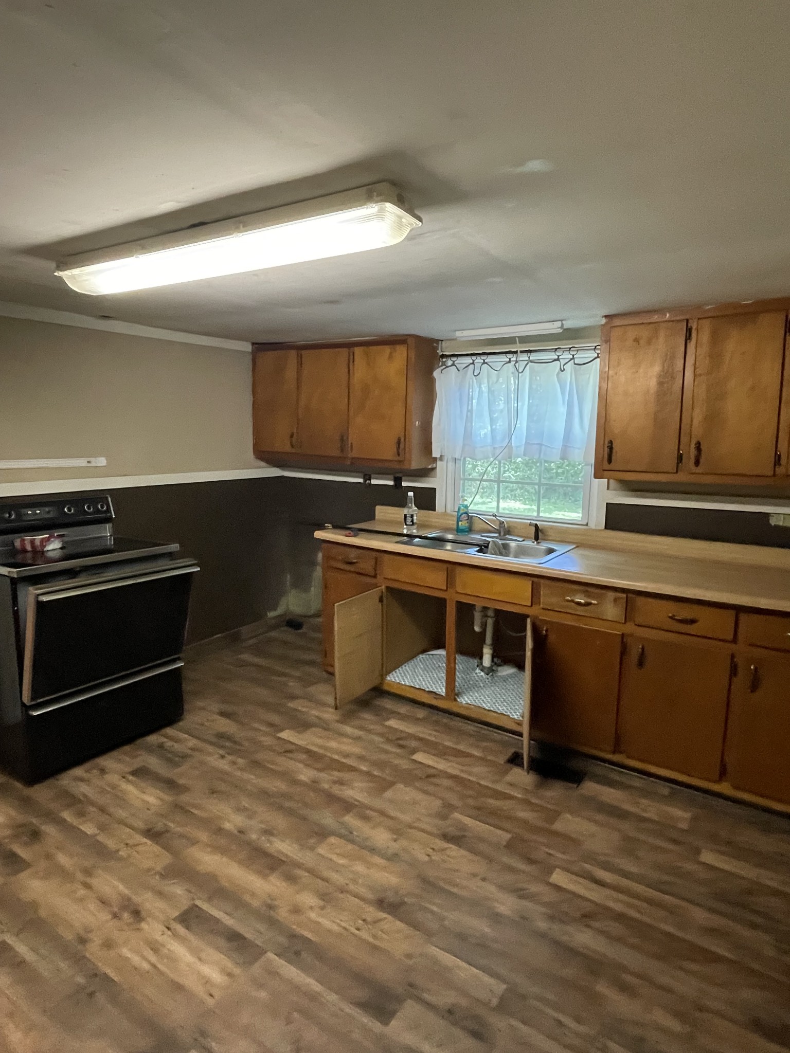 630 Pruett Road Dickson, TN 37055 - Photo 12 of 24 a kitchen with stainless steel appliances granite countertop a stove a sink and a microwave