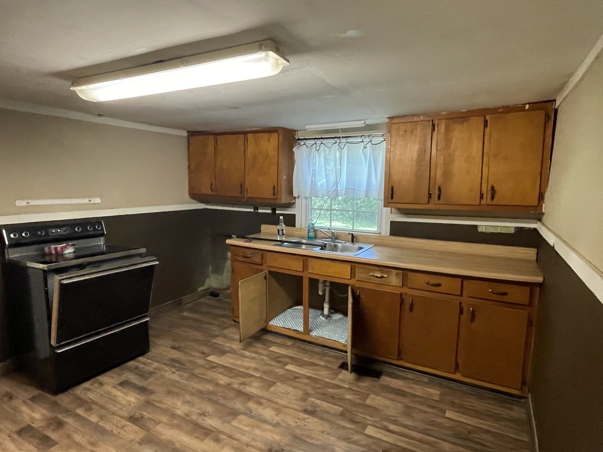 630 Pruett Road Dickson, TN 37055 - Photo 13 of 24 a open kitchen with stainless steel appliances granite countertop a stove a sink and a microwave