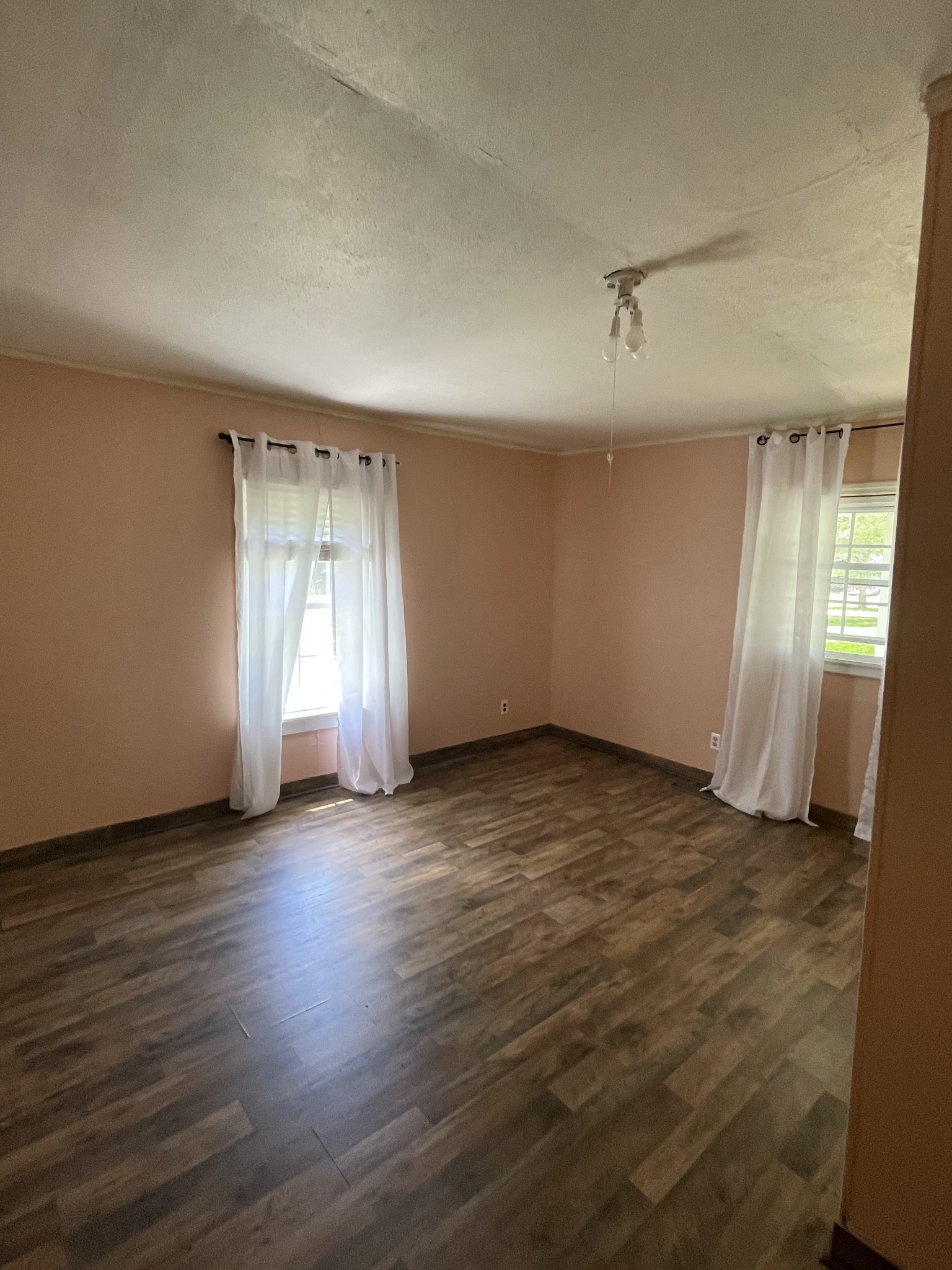 630 Pruett Road Dickson, TN 37055 - Photo 5 of 24 an empty room with wooden floor and windows