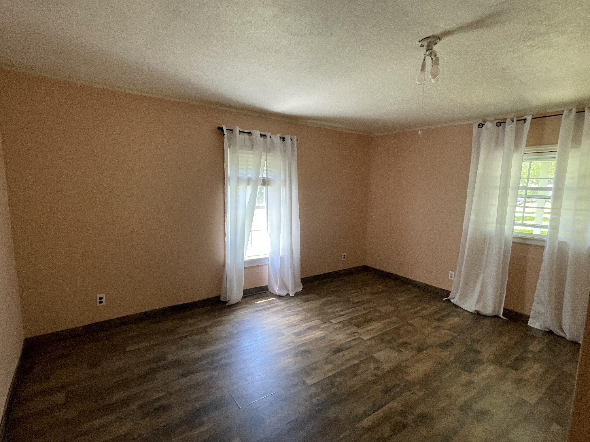630 Pruett Road Dickson, TN 37055 - Photo 6 of 24 an empty room with wooden floor and windows