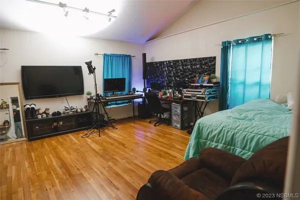 a bathroom with a shower and a sink