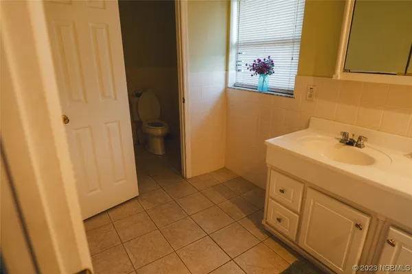 a bathroom with a sink a mirror and a bathtub