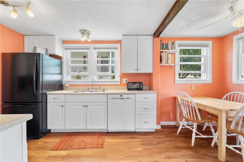 124 5th Street McDonald, PA 15057 - Photo 11 of 24 a kitchen with granite countertop a refrigerator and wooden cabinets