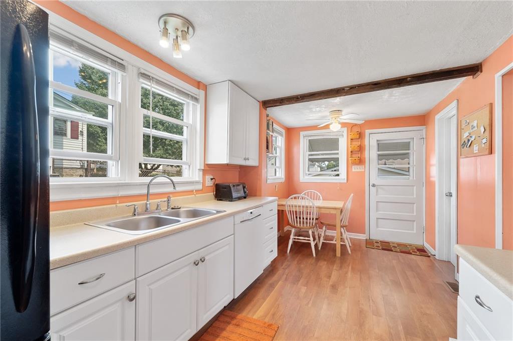 124 5th Street McDonald, PA 15057 - Photo 12 of 24 a kitchen with a sink and wooden cabinets