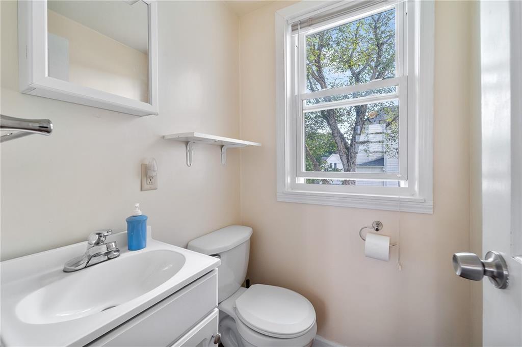 124 5th Street McDonald, PA 15057 - Photo 15 of 24 a bathroom with a sink mirror and toilet