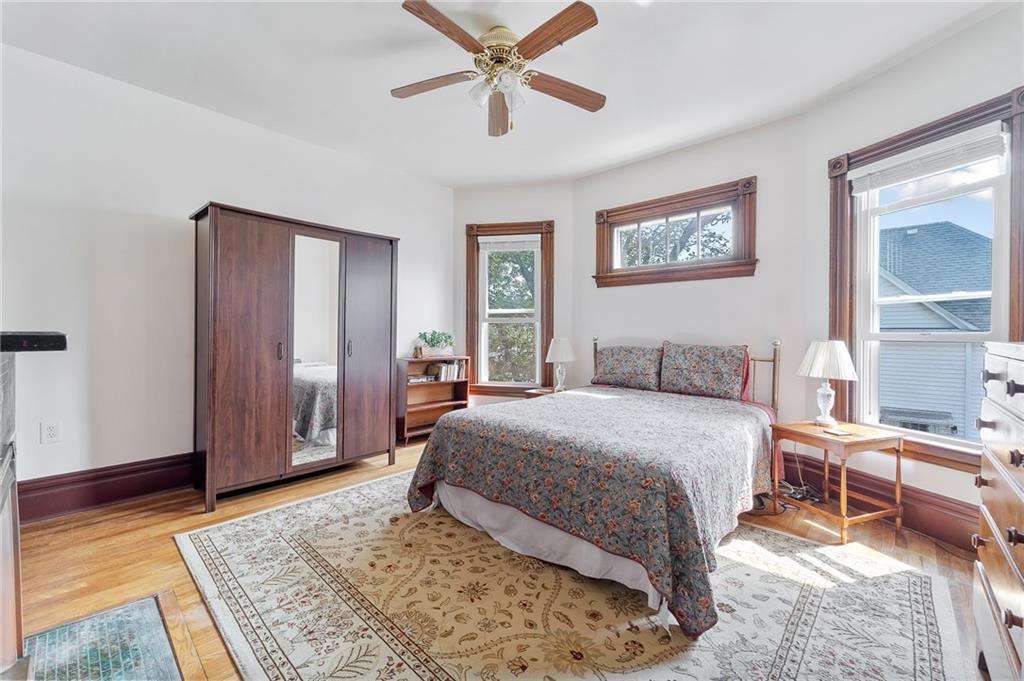 124 5th Street McDonald, PA 15057 - Photo 16 of 24 a spacious bedroom with a bed and a table in it