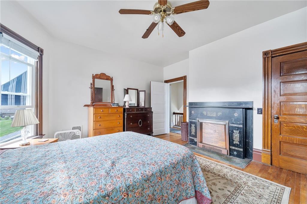 124 5th Street McDonald, PA 15057 - Photo 17 of 24 a bedroom with a bed and dresser with mirror