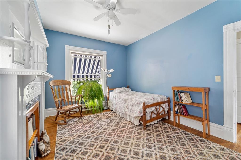 124 5th Street McDonald, PA 15057 - Photo 18 of 24 a bedroom with a bed and a chandelier