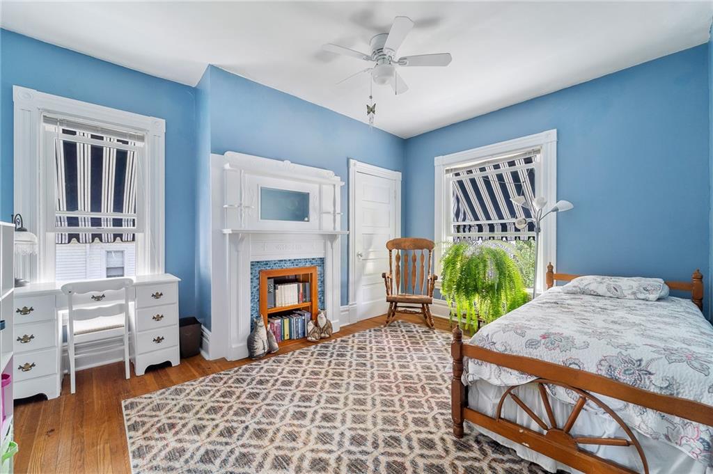 124 5th Street McDonald, PA 15057 - Photo 20 of 24 a bedroom with furniture and a fireplace