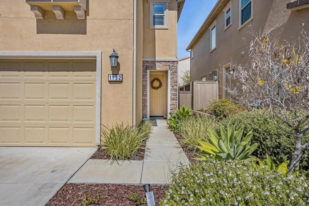 1132 Cherry Tree Lane Vista, CA 92084 - Photo 1 of 1 a potted plant sitting in front of a building