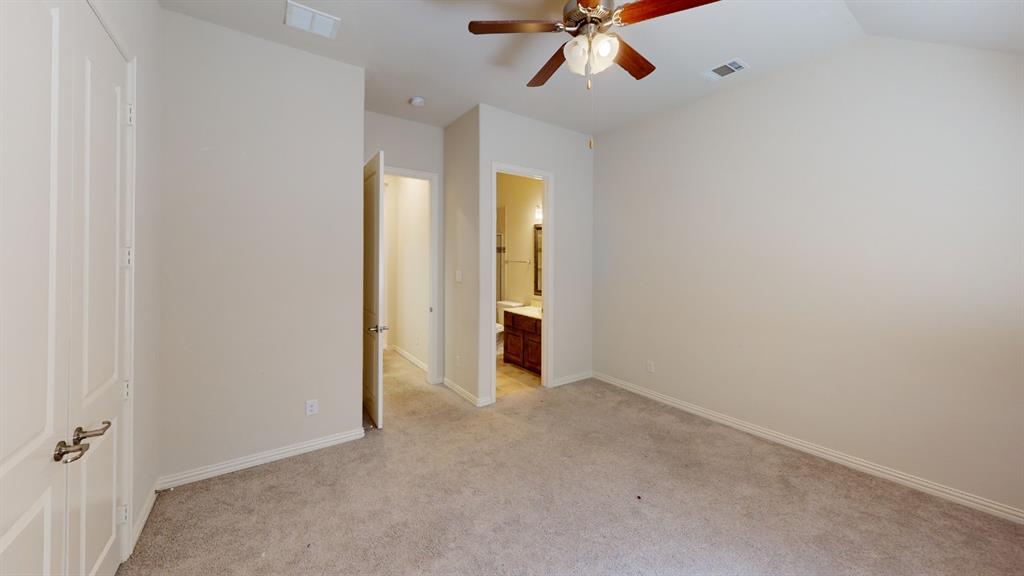 14712 Spitfire Trail Fort Worth, TX 76262 - Photo 16 of 25 Spacious room with plush carpet flooring and light neutral wall finishes