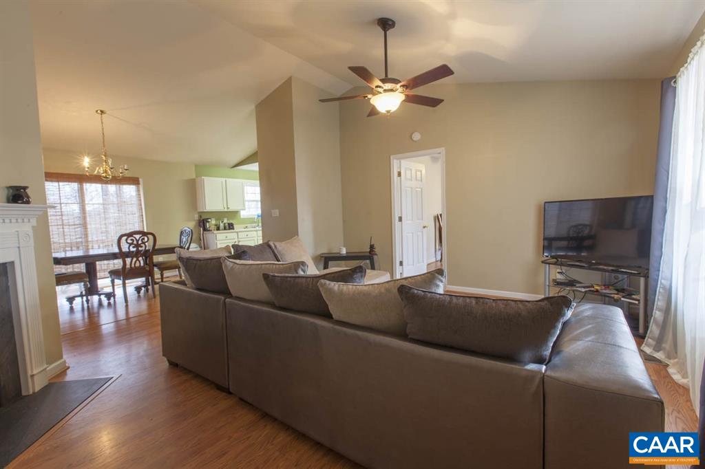 212 Petunia Road Ruckersville, VA 22968 - Photo 3 of 32 a living room with furniture and a flat screen tv