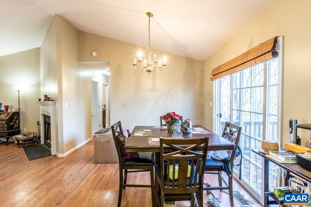 212 Petunia Road Ruckersville, VA 22968 - Photo 8 of 32 a view of a dining room with furniture and a chandelier