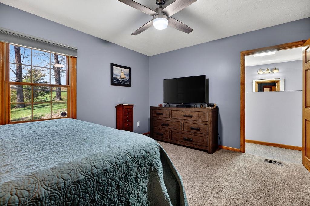 329 Red Hill Road Fairfield, VA 24435 - Photo 25 of 74 a bedroom with a bed and a flat screen tv