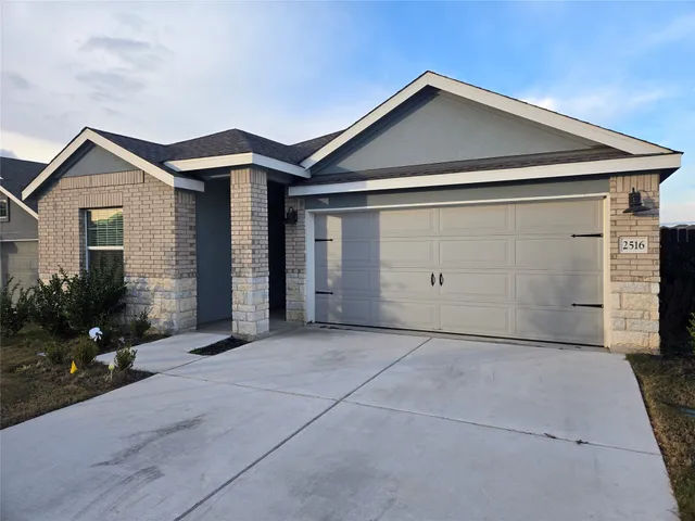 a front view of a house with garage