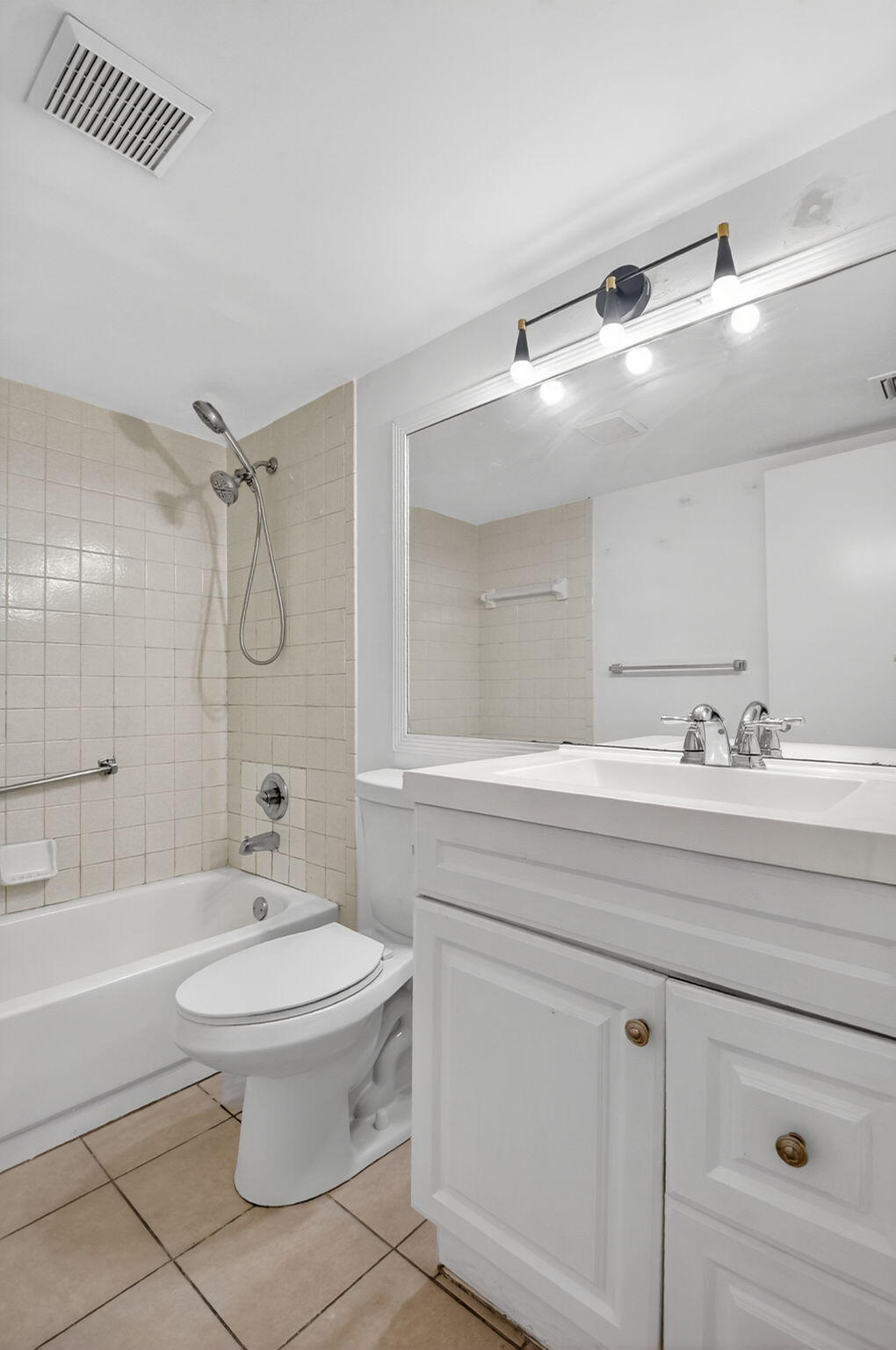 208 Foxtail Drive, Unit B2 Greenacres, FL 33415 - Photo 20 of 33 a bathroom with a sink toilet and shower