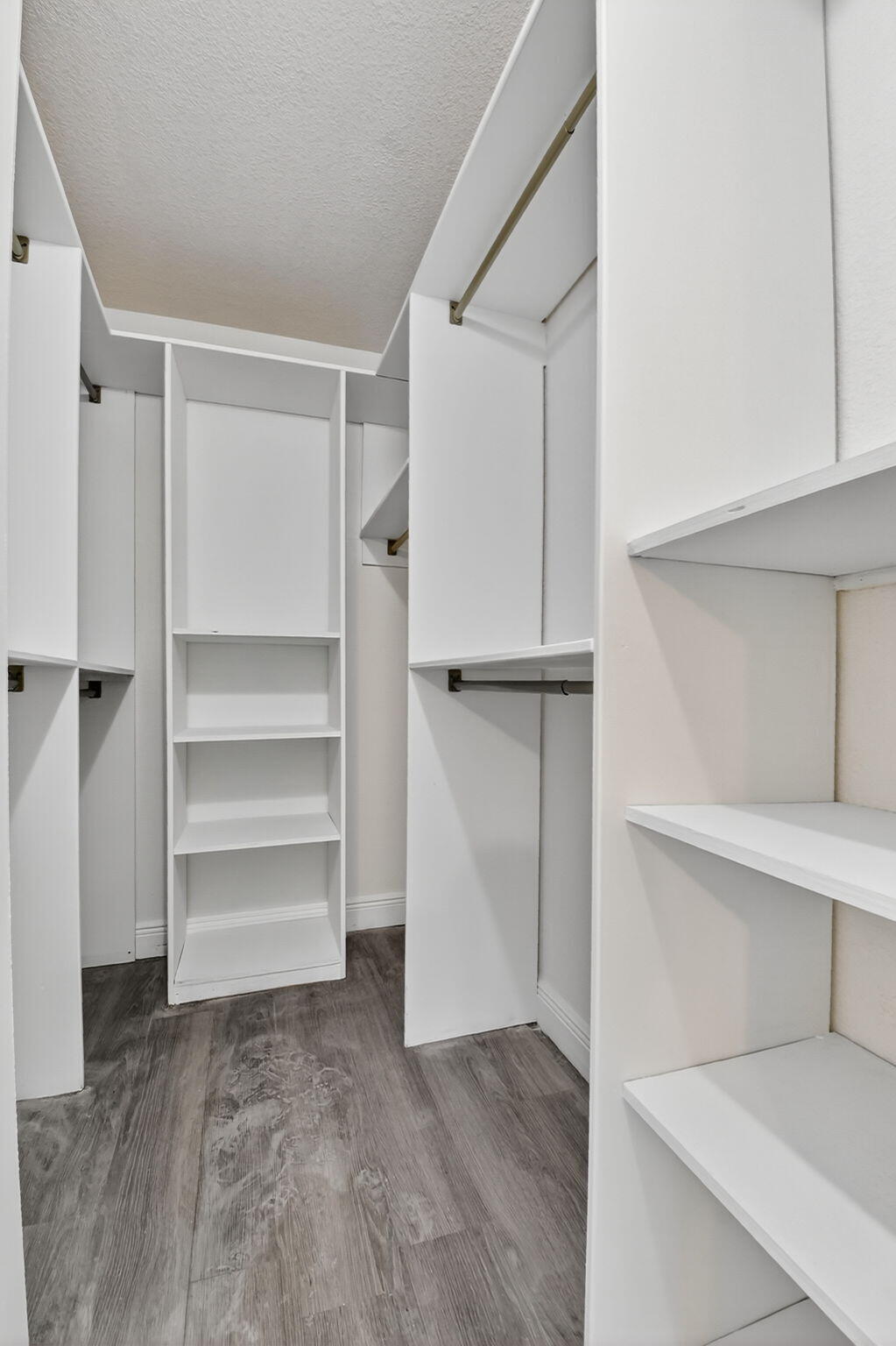 208 Foxtail Drive, Unit B2 Greenacres, FL 33415 - Photo 26 of 33 a view of walk in closet with empty racks