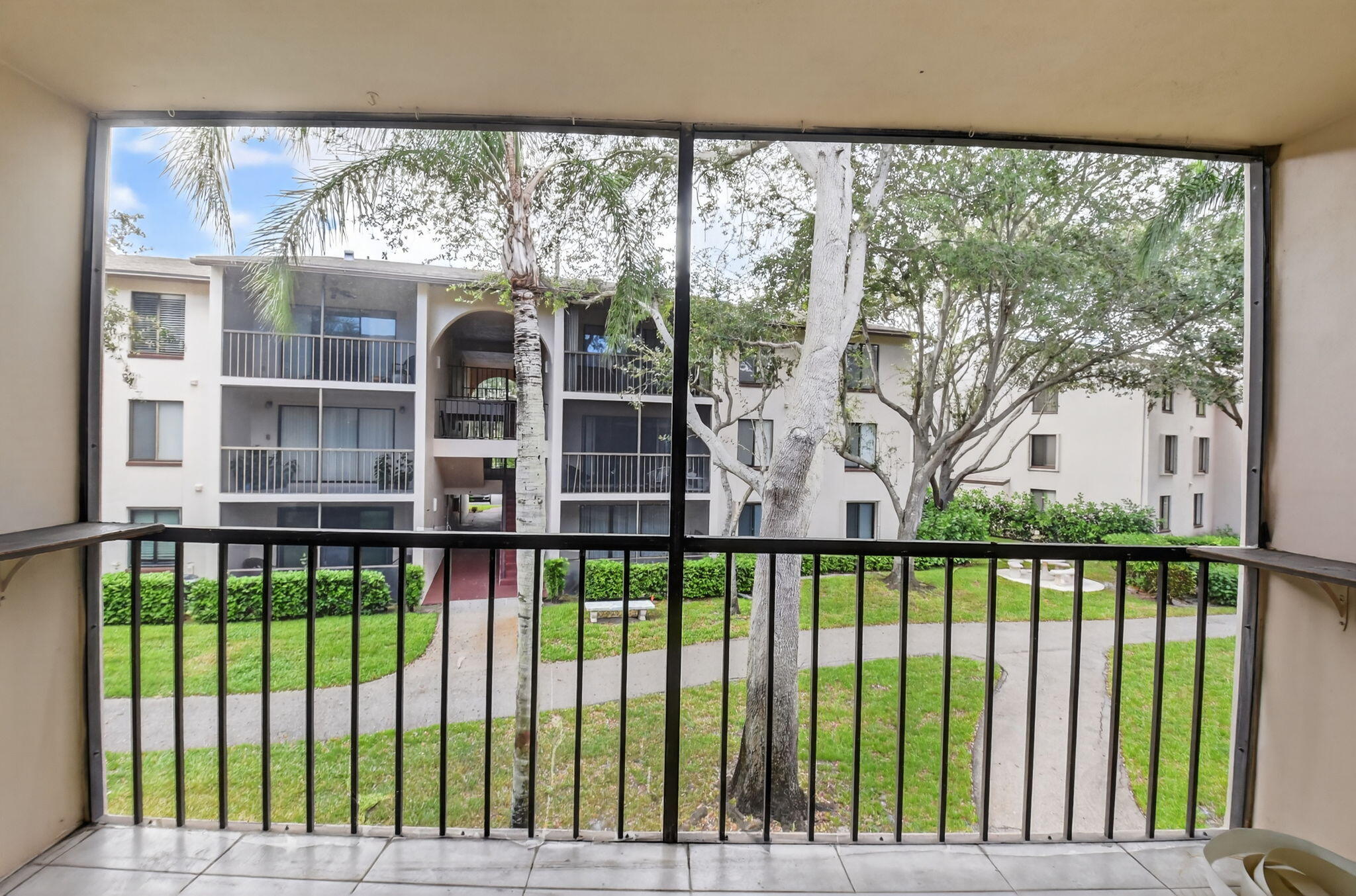 208 Foxtail Drive, Unit B2 Greenacres, FL 33415 - Photo 28 of 33 a view of a house with a swimming pool