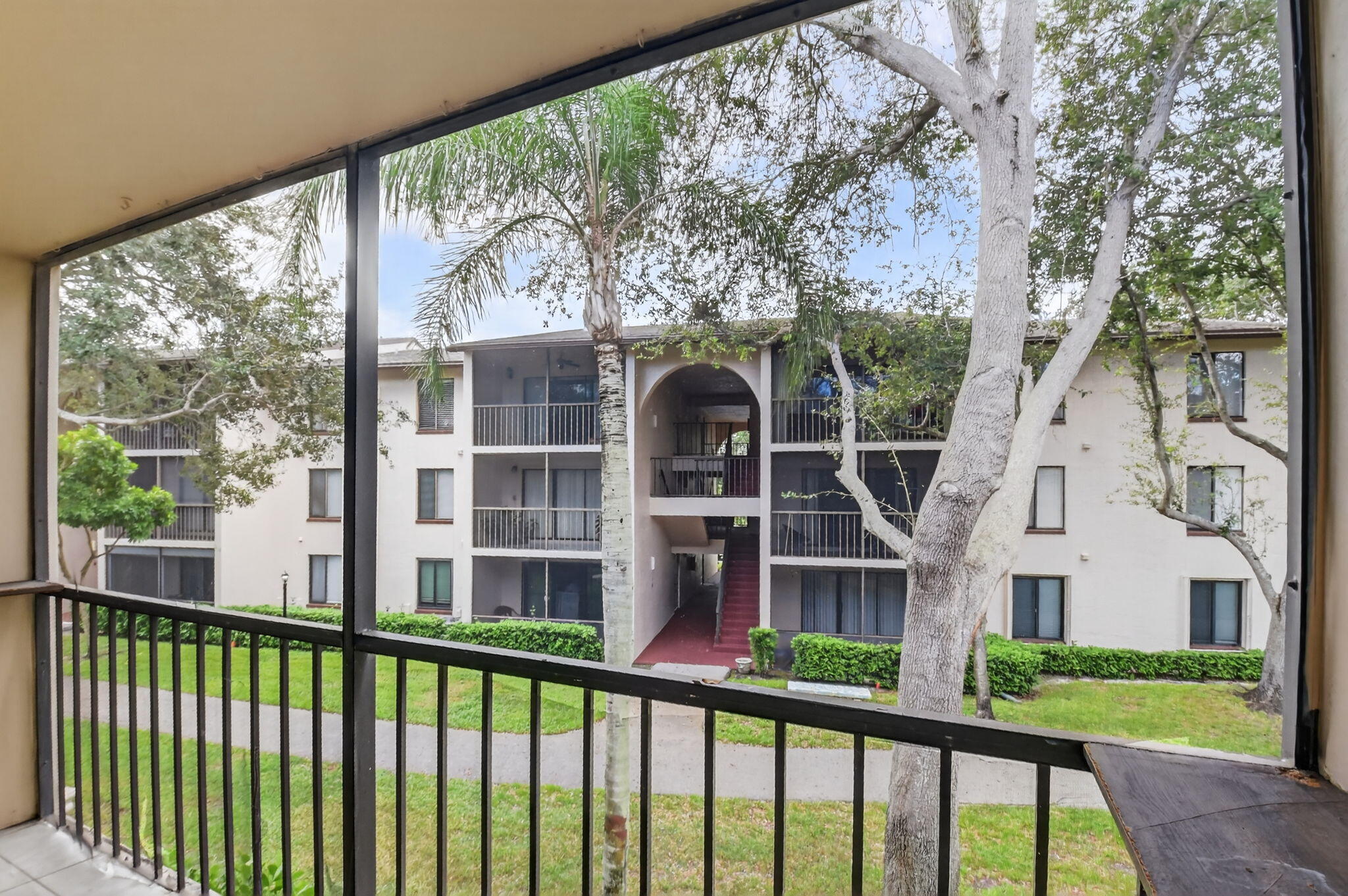 208 Foxtail Drive, Unit B2 Greenacres, FL 33415 - Photo 30 of 33 a view of a building from a balcony