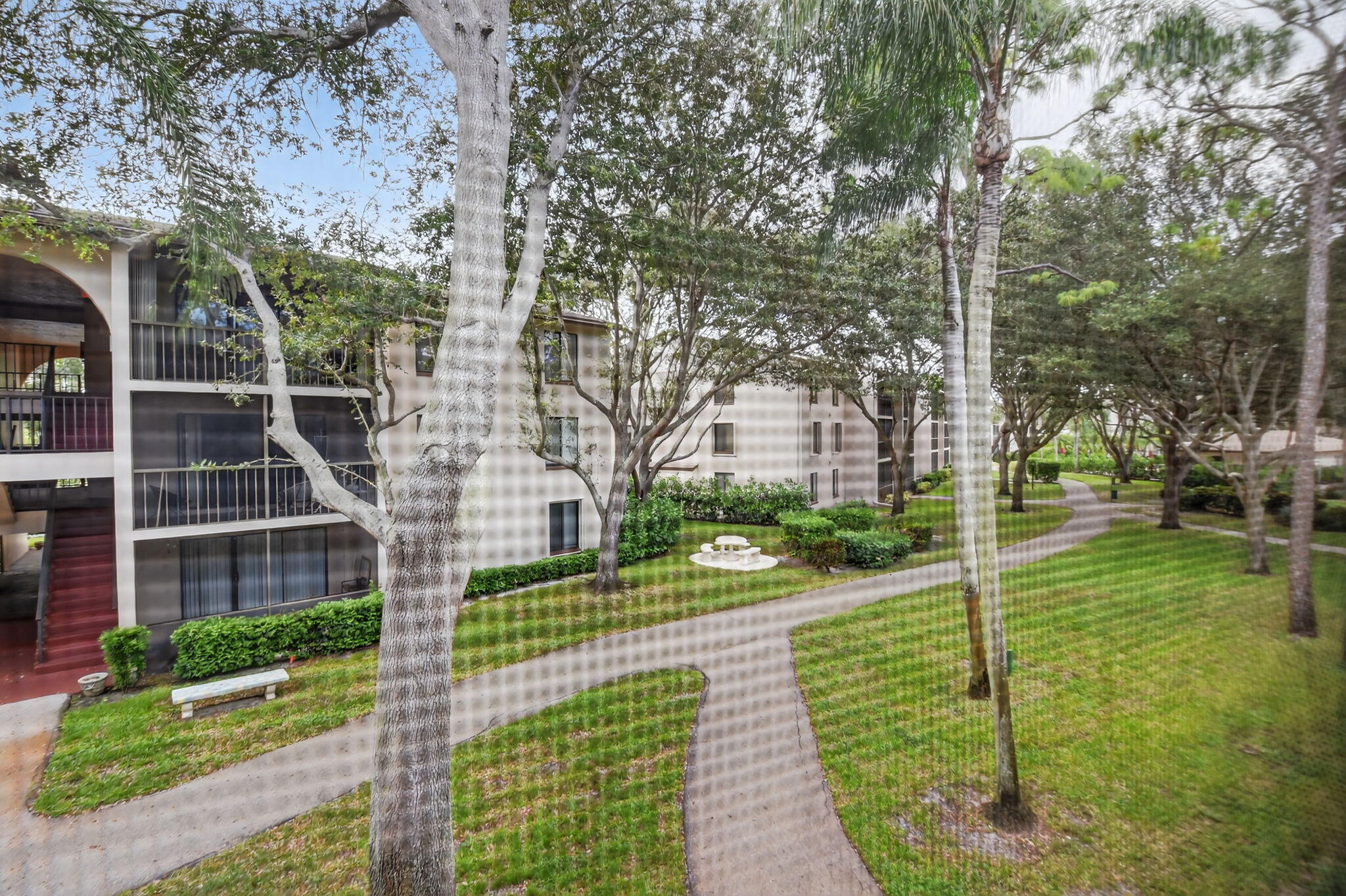 208 Foxtail Drive, Unit B2 Greenacres, FL 33415 - Photo 31 of 33 a view of a park with large trees