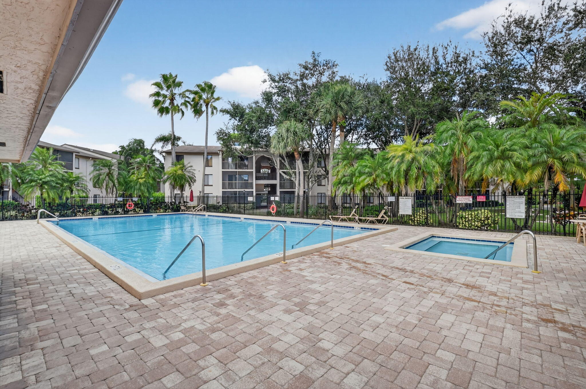 208 Foxtail Drive, Unit B2 Greenacres, FL 33415 - Photo 32 of 33 a view of outdoor space yard and swimming pool