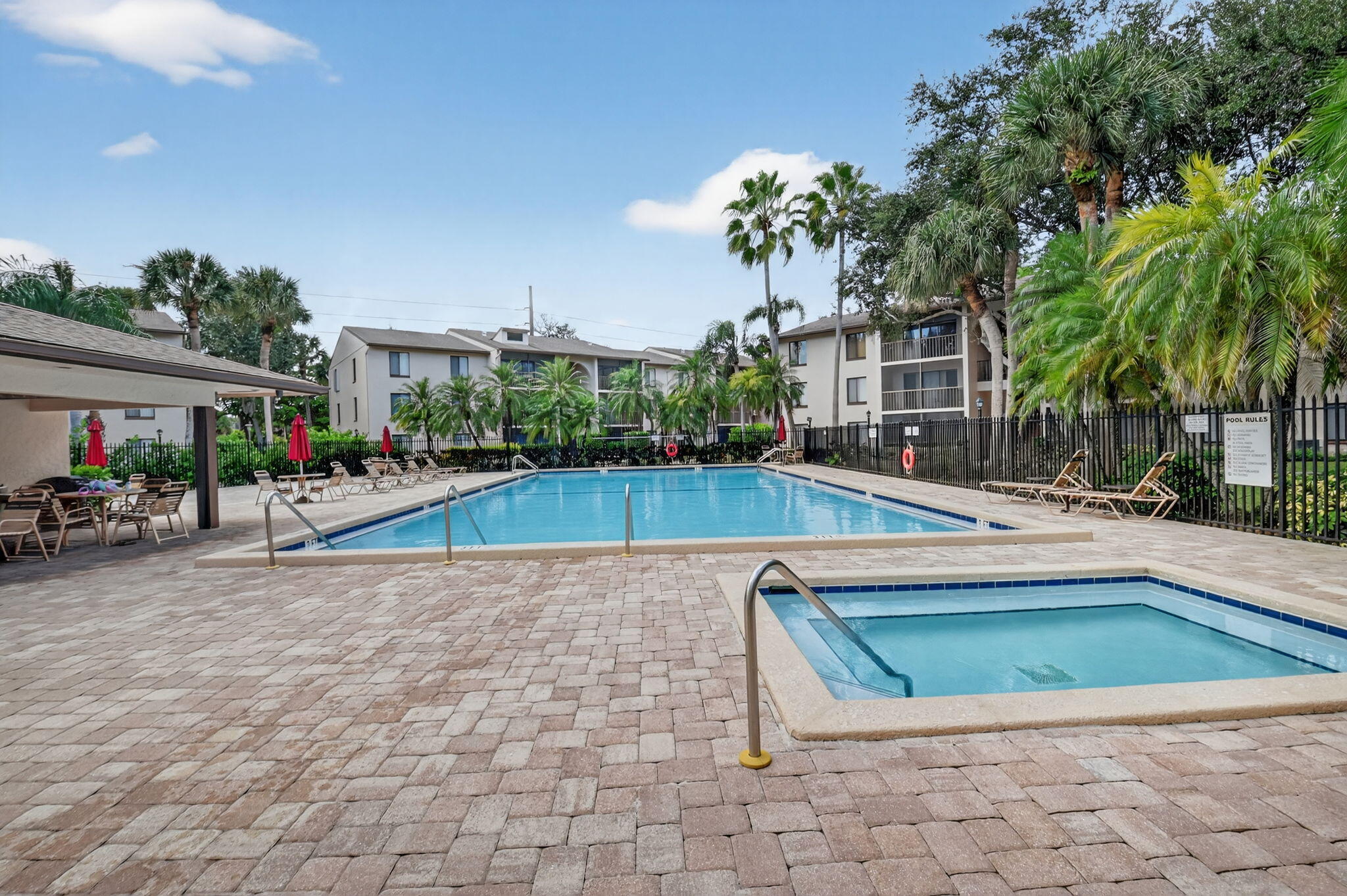 208 Foxtail Drive, Unit B2 Greenacres, FL 33415 - Photo 33 of 33 a view of a house with swimming pool and sitting area