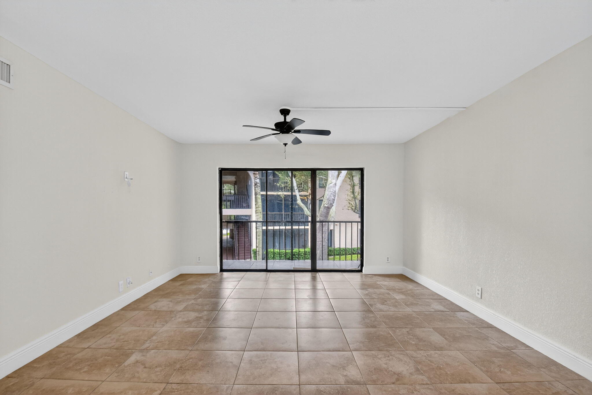208 Foxtail Drive, Unit B2 Greenacres, FL 33415 - Photo 6 of 33 a view of an empty room with a window