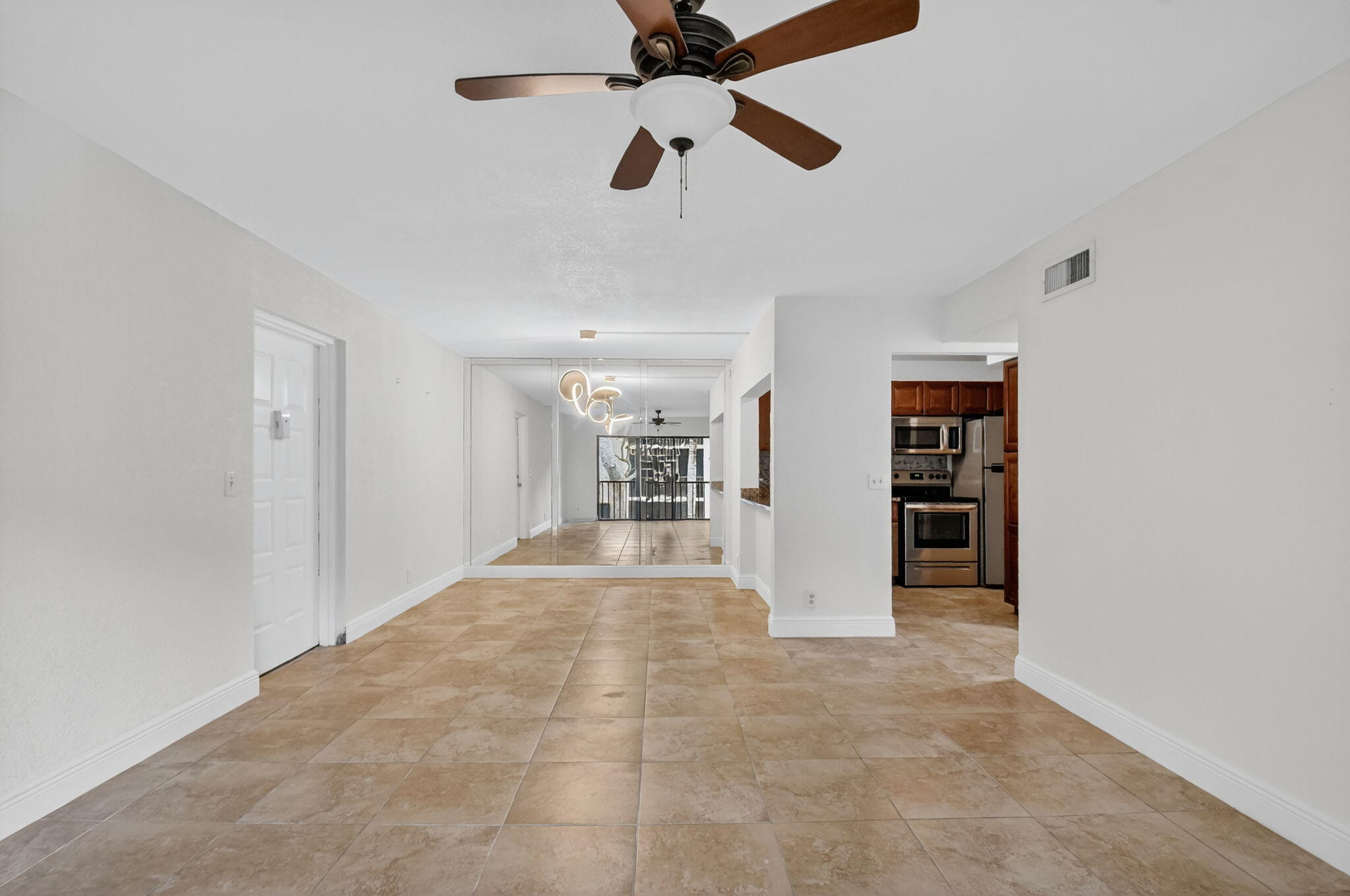 208 Foxtail Drive, Unit B2 Greenacres, FL 33415 - Photo 7 of 33 a view of empty room with a ceiling fan