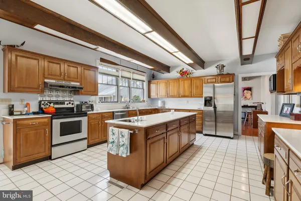 a spacious bedroom with a bed and a window