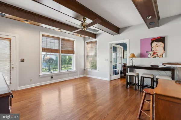 a living room with furniture a table and a flat screen tv