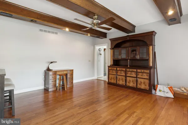 a living room with lots of furniture and a projector