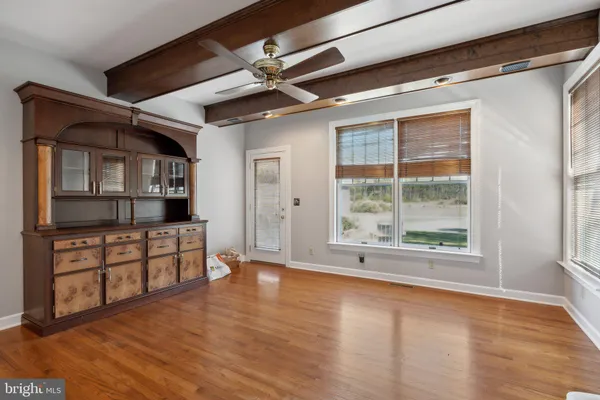 a living room with lots of furniture and a table