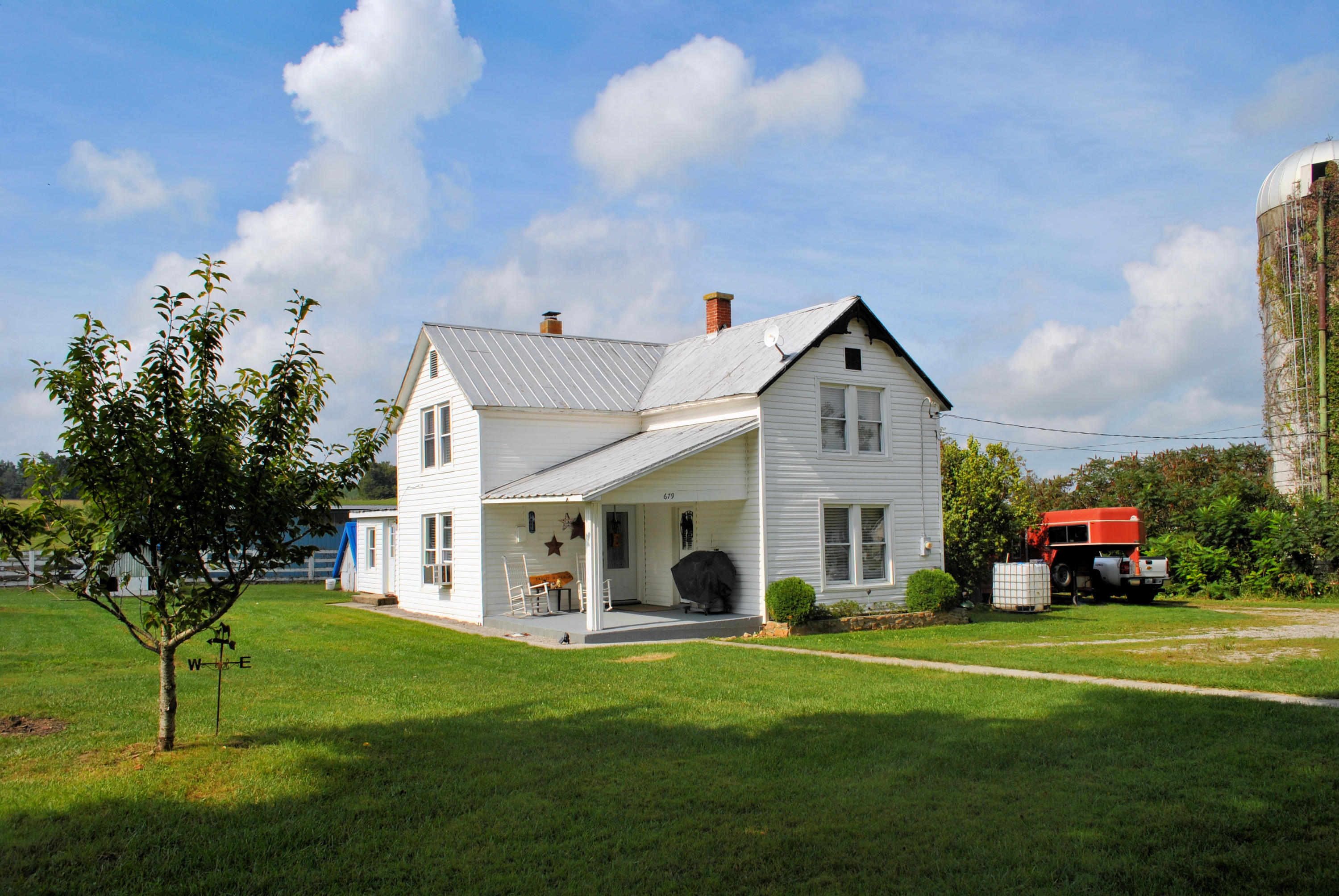 679 Union Valley Road Riner, VA 24149 - Photo 1 of 69 a front view of a house with a garden and yard