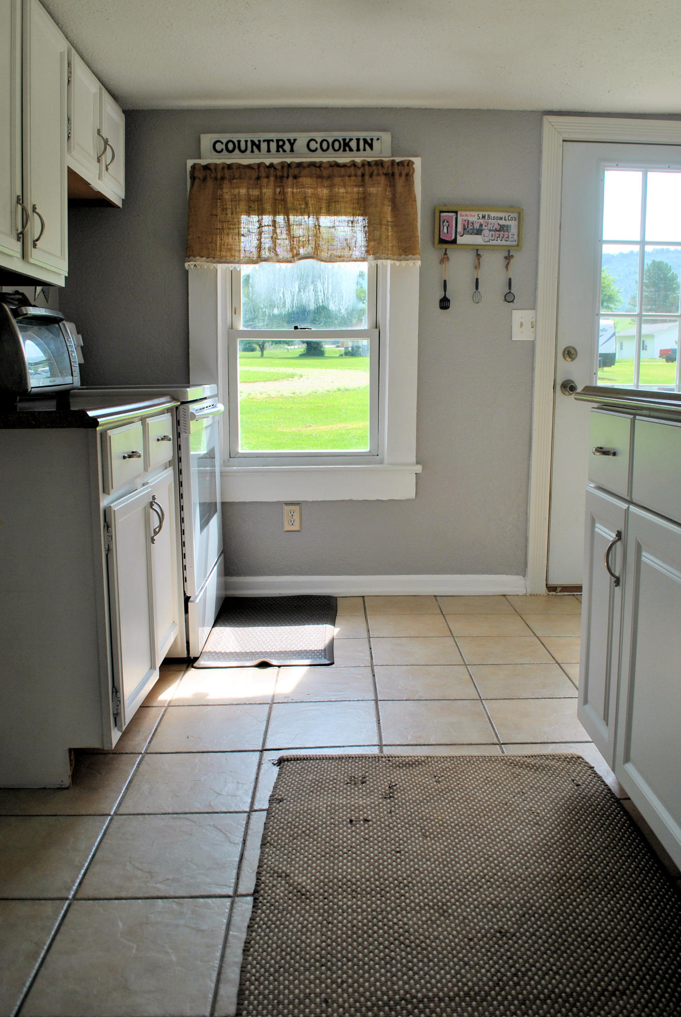 679 Union Valley Road Riner, VA 24149 - Photo 14 of 69 a kitchen with stainless steel appliances a stove a refrigerator a sink and a window