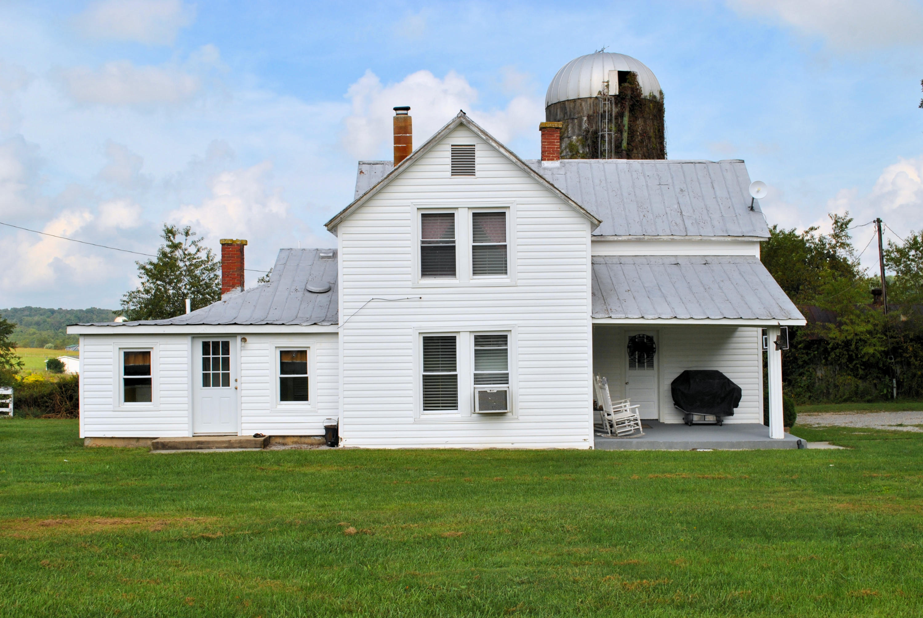 679 Union Valley Road Riner, VA 24149 - Photo 3 of 69 a front view of a house with a garden