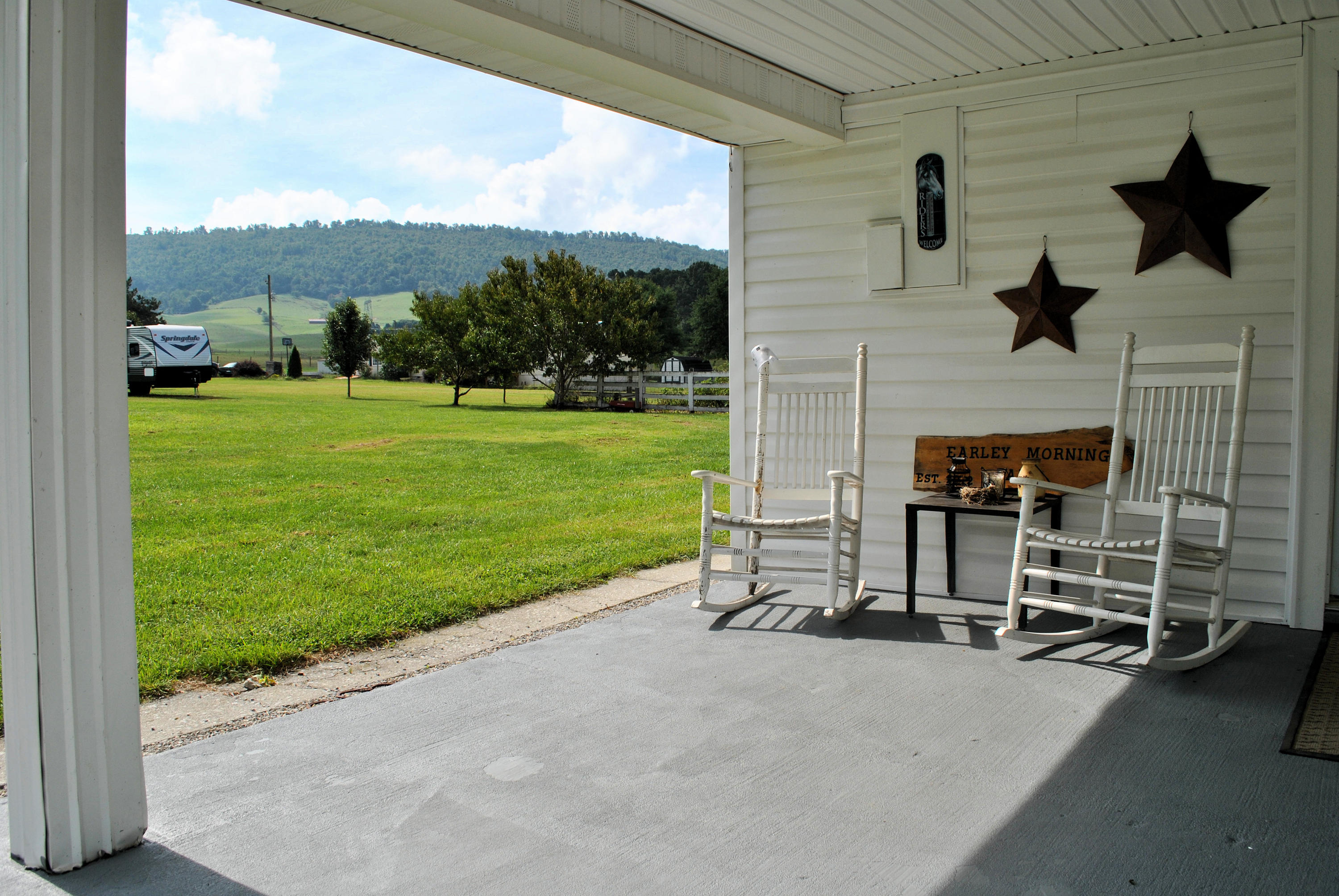 679 Union Valley Road Riner, VA 24149 - Photo 9 of 69 a view of a porch with a yard