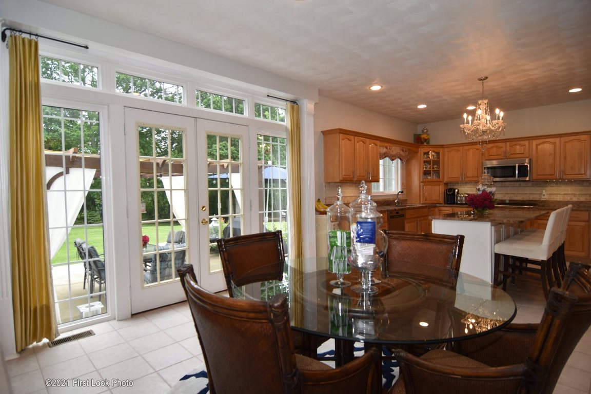 64 Red Hawk Drive Cranston, RI 02921 - Photo 11 of 49 VIEW FROM THE FAMILY ROOM LOOKING INTO THE EATING AREA AND KITCHEN. DOORS LEAD TO THE BACKYARD