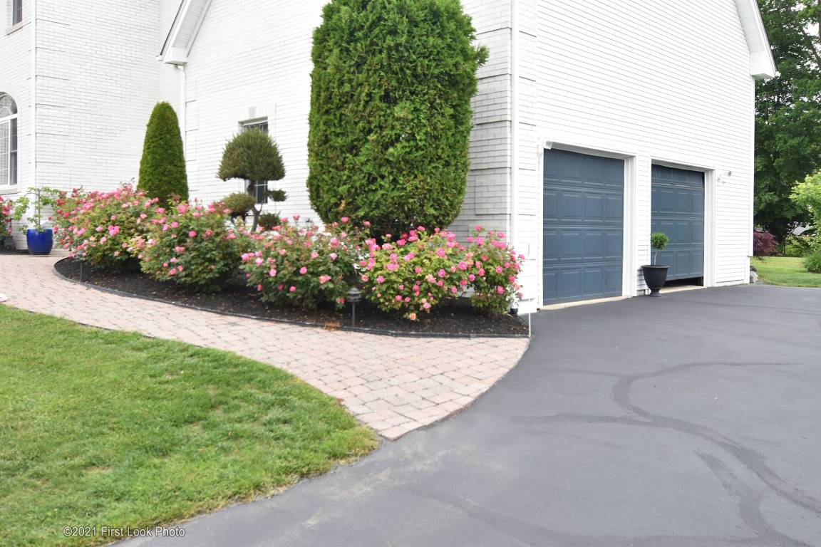 64 Red Hawk Drive Cranston, RI 02921 - Photo 49 of 49 VIEW OF 2 CAR GARAGE AND MORE FLOWER GARDENS