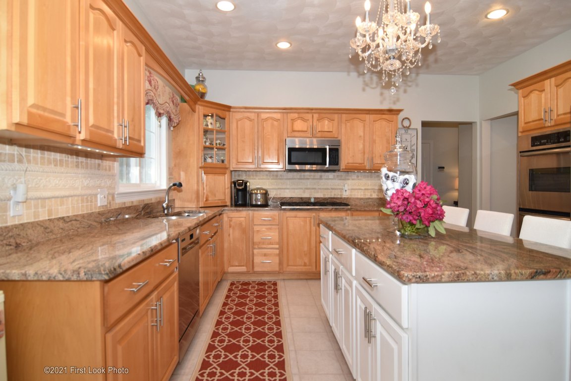 64 Red Hawk Drive Cranston, RI 02921 - Photo 7 of 49 KITCHEN SHOWING CENTER ISLAND AND GRANITE COUNTER TOPS