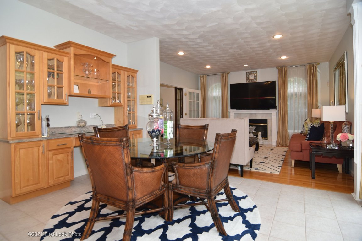 64 Red Hawk Drive Cranston, RI 02921 - Photo 10 of 49 VIEW FROM THE KITHCN LOOKING AT AN EATING AREA OFF THE KITCHEN WITH THE FAMILY ROOM IN THE REAR OF THE PICTURE