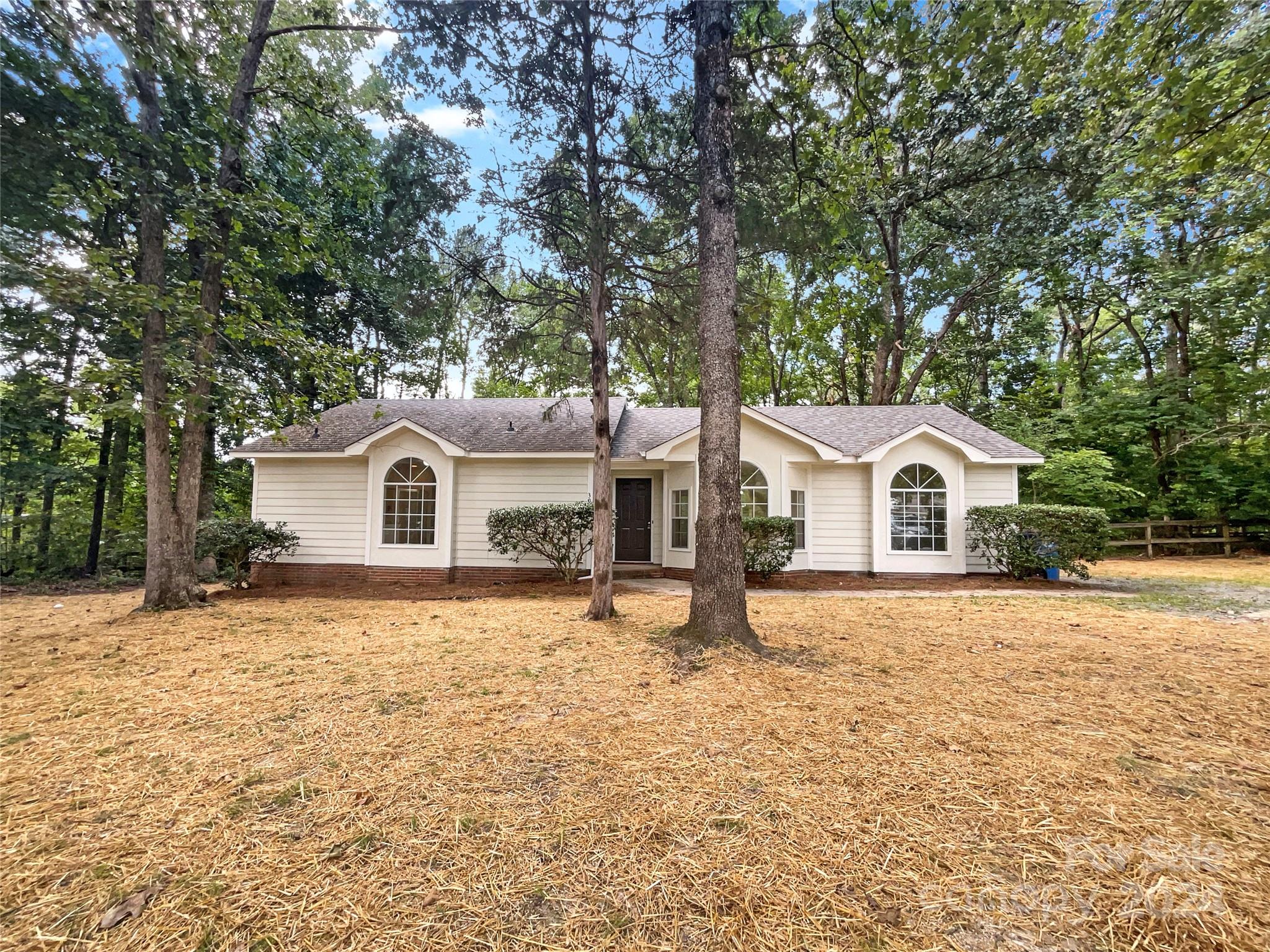 3011 Stevens Mill Road Matthews, NC 28104 - Photo 1 of 21 a front view of a house with a yard