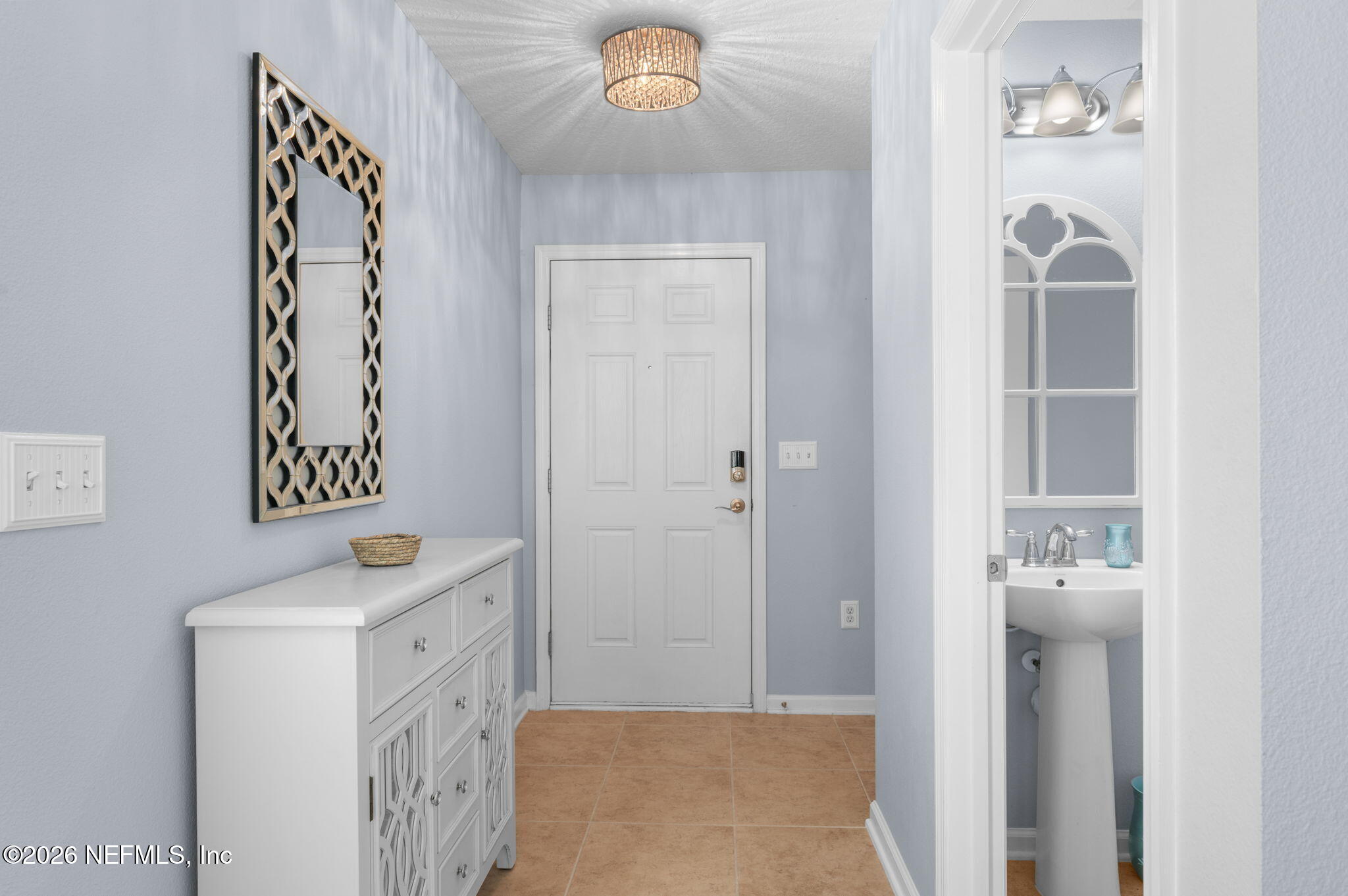 12 Islander Court St. Augustine, FL 32080 - Photo 12 of 53 a bathroom with a sink a mirror and a window