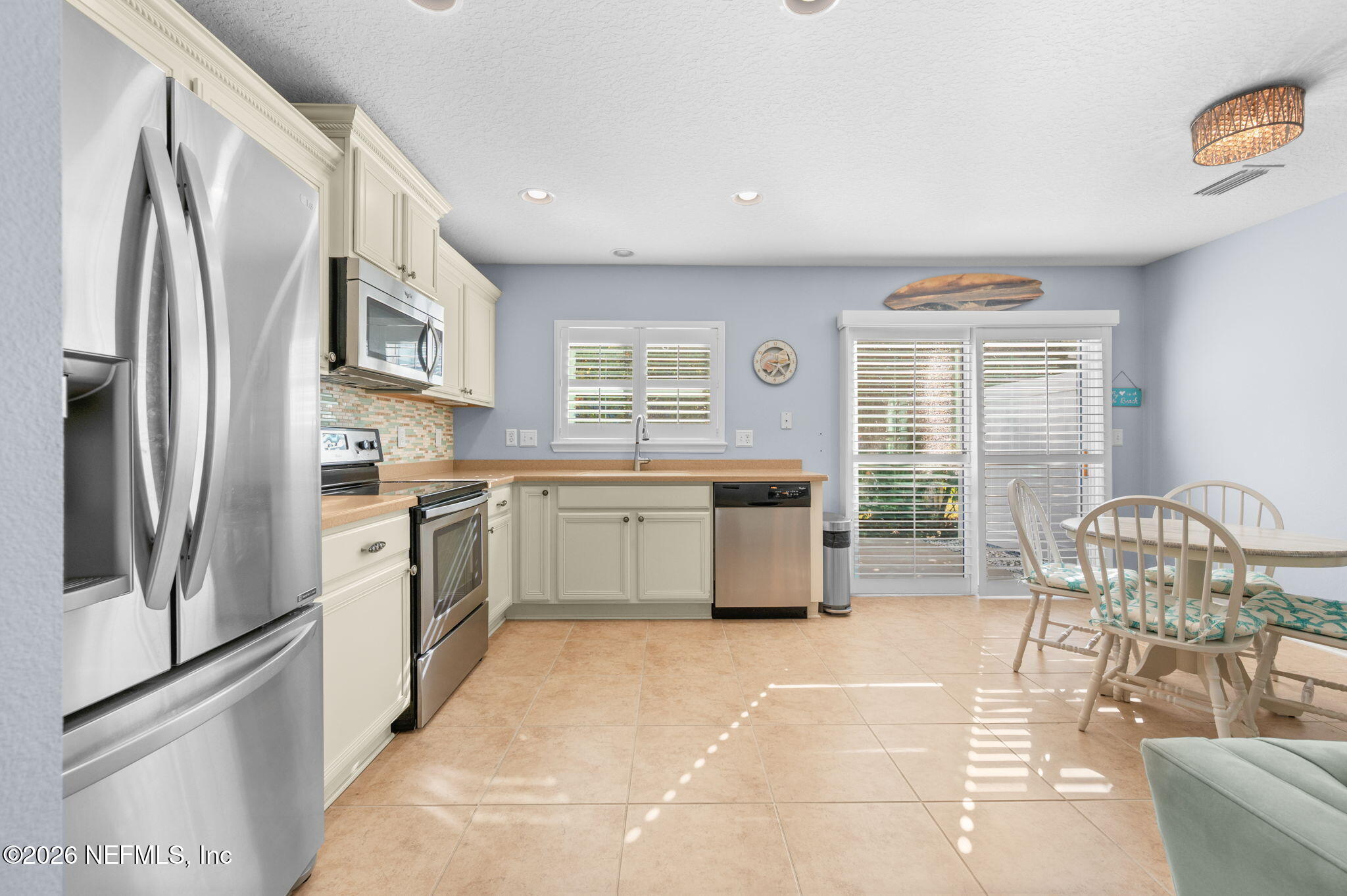 12 Islander Court St. Augustine, FL 32080 - Photo 18 of 53 a kitchen with stainless steel appliances a stove a sink and a refrigerator