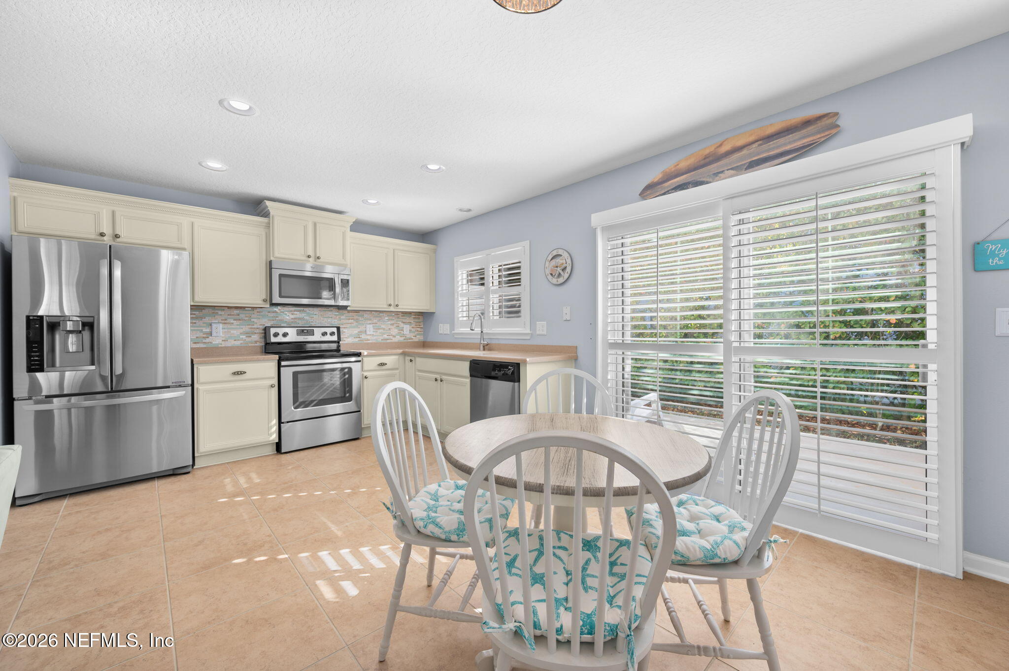 12 Islander Court St. Augustine, FL 32080 - Photo 22 of 53 a kitchen with stainless steel appliances granite countertop a kitchen island hardwood floor and a window