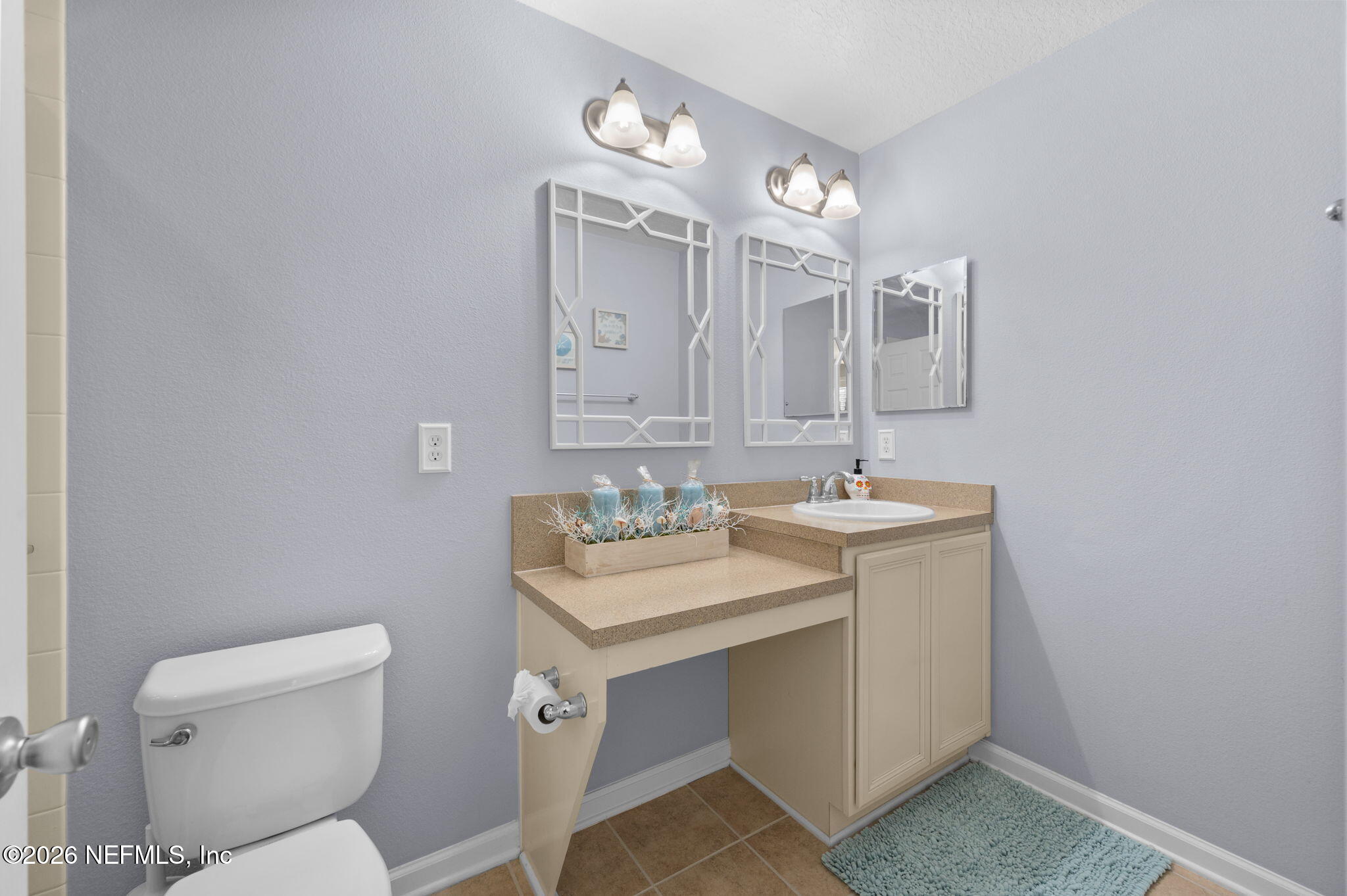 12 Islander Court St. Augustine, FL 32080 - Photo 29 of 53 a bathroom with a toilet sink and mirror