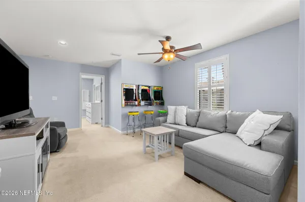 a living room with furniture and a window