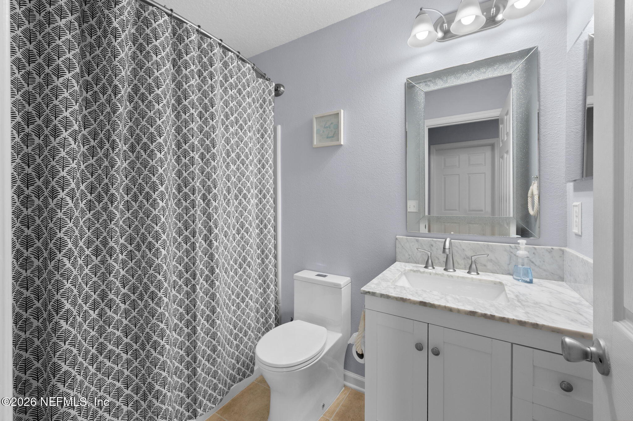 12 Islander Court St. Augustine, FL 32080 - Photo 34 of 53 a bathroom with a granite countertop toilet and a sink