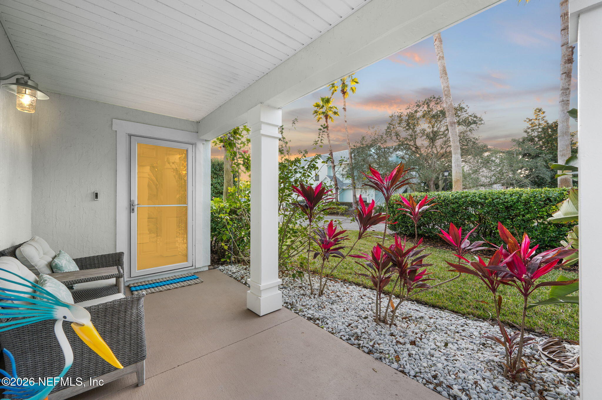 12 Islander Court St. Augustine, FL 32080 - Photo 50 of 53 a view of a porch with furniture and floor to ceiling window
